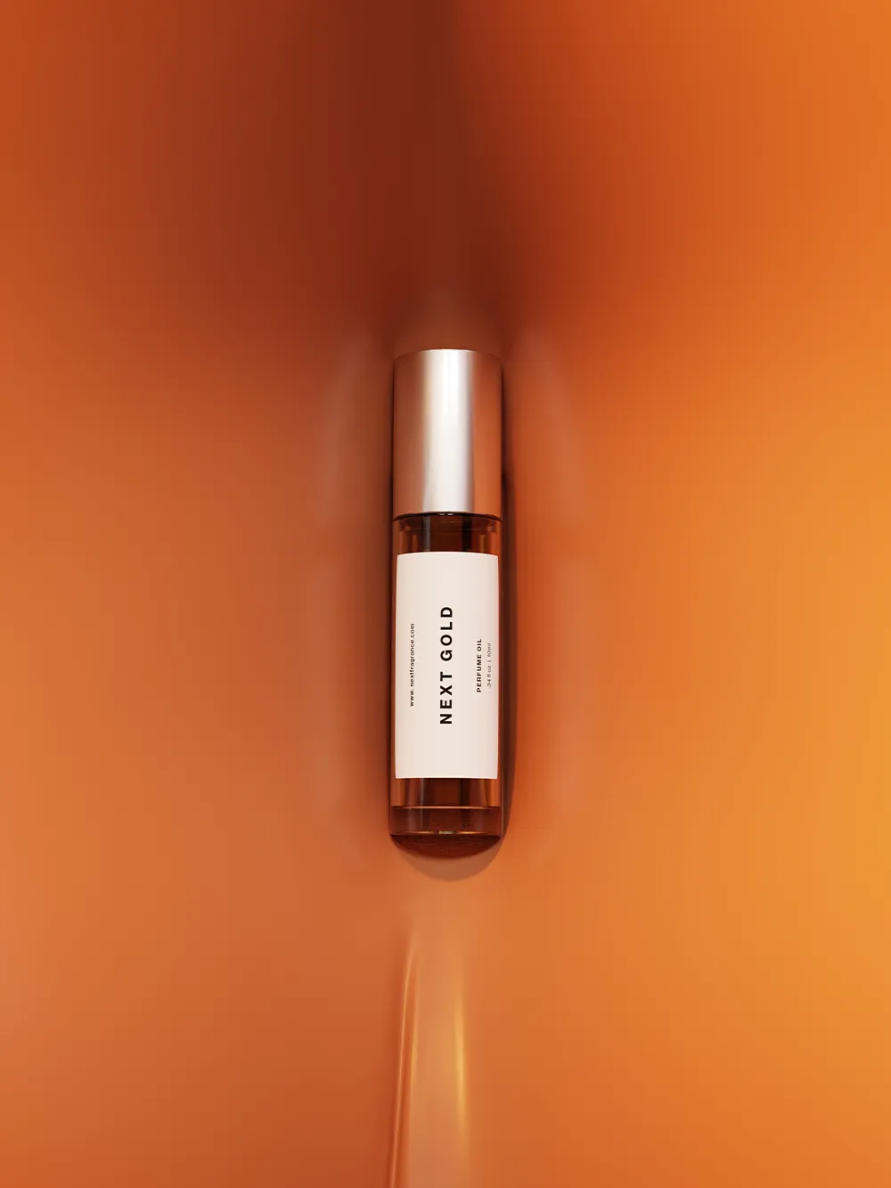 Next Gold perfume oil, 10ml roll-on, standing on a warm amber ground